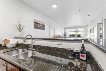 Richland apartment for rent - A kitchen with a granite countertop and a stainless steel sink.