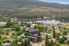 Post Falls apartment for rent - A small town with a large lake and a dam in the background.