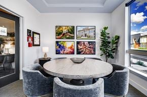 Walla Walla apartment for rent - a dining room with a table and chairs and pictures on the wall