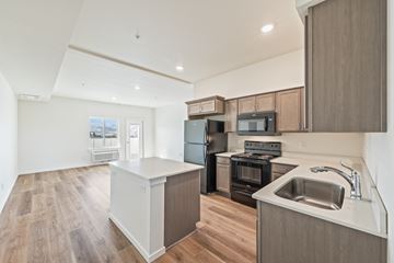 East Wenatchee apartment for rent - A kitchen with a black oven and microwave.