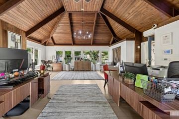 Eugene apartment for rent - A living room with a grey rug and a wooden ceiling.
