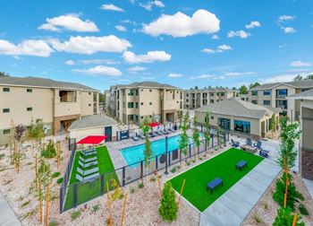 Resort-style swimming pool with spa grill area