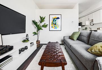 Walla Walla apartment for rent - a living room with a couch and a coffee table and a television