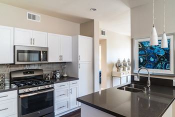 Quartz stone countertops and designer-inspired custom cabinetry