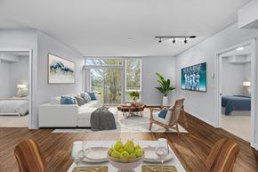 Bainbridge apartment for rent - A dining room with a table set for two and a view of the backyard.