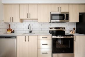 Gresham apartment for rent - The Wes Gresham Oregon Apartments bright kitchen with stainless steel appliances