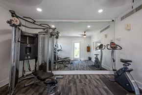 Tucson apartment for rent - A well-equipped home gym with a variety of exercise machines.