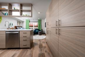 Tacoma apartment for rent - A modern kitchen with wooden cabinets and a stainless steel dishwasher.