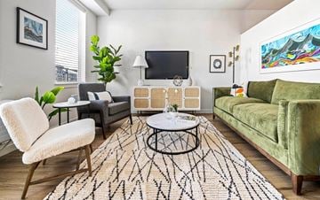 Bend apartment for rent - a living room with a couch and a tv