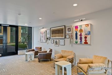 Bend apartment for rent - A living room with a variety of chairs and artwork on the wall.