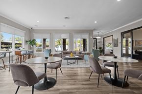 Fair Oaks apartment for rent - A modern dining room with a glass table surrounded by grey chairs.