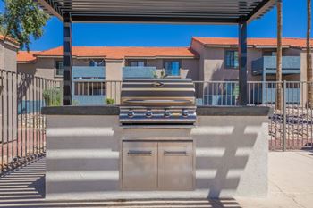 Outdoor kitchen with builtin grill and storage