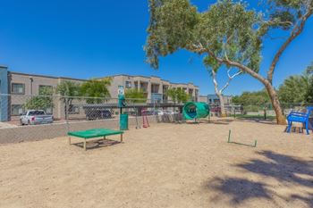 Playground area with climbing equipment and sand surface