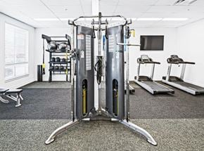 Walla Walla apartment for rent - a gym with cardio equipment and a tv in a room