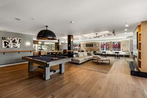 Seattle apartment for rent - A room with a pool table and a couch.