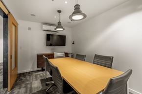 Seattle apartment for rent - A conference room with a long table and chairs.
