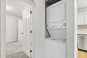 Everett apartment for rent - A white oven and microwave are built into a kitchen cabinet.
