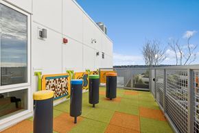 Seattle apartment for rent - A white building with a green and orange tiled floor.