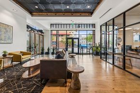 Portland apartment for rent - Front lobby with large windows and office at Grand Belmont Apartments in Central Eastside Portland, Oregon.