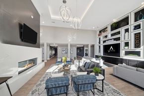 Denver apartment for rent - A modern living room with a fireplace and a television.