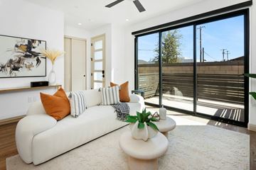 Phoenix apartment for rent - A living room with a white couch and a painting on the wall.