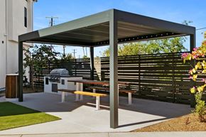 Phoenix apartment for rent - A picnic area with a table and benches under a shelter.