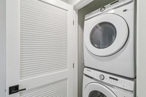 Chula Vista apartment for rent - A white washing machine is stacked on top of another in a small space.