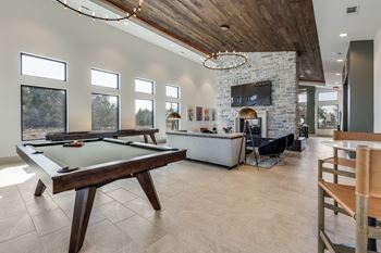 Game room with billiards and shuffleboard