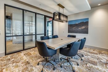 Business lounge with conference room and private huddle spaces