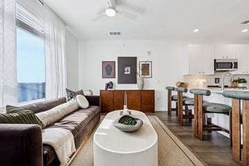 Allen apartment for rent - A modern living room with a brown couch and a white coffee table.
