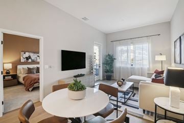 Chula Vista apartment for rent - A living room with a white table and chairs.