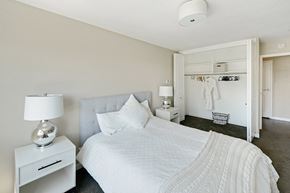 Portland apartment for rent - Bedroom with neutral colored walls and lots of natural light at  735 St. Clair Apartments in Portland, Oregon