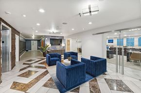 Portland apartment for rent - Lobby with seating and television at  735 St. Clair Apartments in Portland, Oregon
