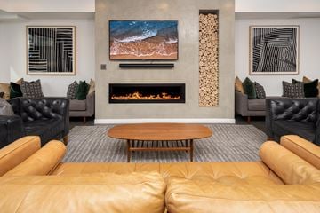 Layton apartment for rent - A living room with a fireplace and a painting on the wall.