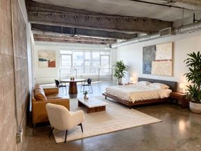 North Hollywood apartment for rent - A bedroom with a bed, chair, and a table.