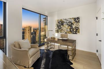 Seattle apartment for rent - A living room with a chair, a table, and a painting on the wall.