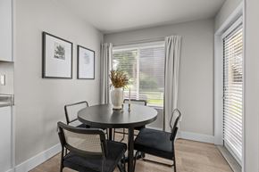 Kennewick apartment for rent - a dining room with a table and chairs and a window