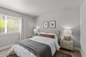 Kennewick apartment for rent - a bedroom with a bed and a large window