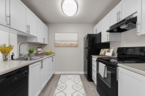 Bothell apartment for rent - our spacious kitchens are equipped with black appliances and white cabinets