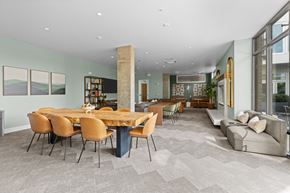 Seattle apartment for rent - a dining room with a wooden table and chairs