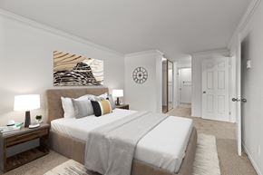 Bellevue apartment for rent - A bedroom with a large bed and a painting on the wall.