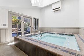 Renton apartment for rent - A small indoor pool with a skylight above it.