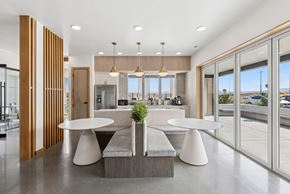 Pasco apartment for rent - A modern dining area with a table and chairs set up.