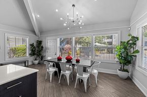 Lynwood apartment for rent - a dining room with a table and chairs and a large window