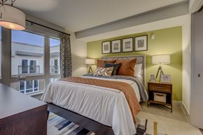 Bellevue apartment for rent - a bedroom with a large bed and a window