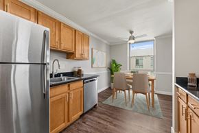 Walnut Creek apartment for rent - A kitchen with wooden cabinets and a stainless steel refrigerator.
