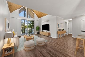 Walnut Creek apartment for rent - A living room with a white couch and a wooden floor.