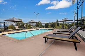 Kent apartment for rent - Alexan Gateway swimming pool with lounge chairs and umbrellas