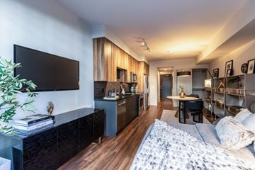 Seattle apartment for rent - a living room with a couch and a tv