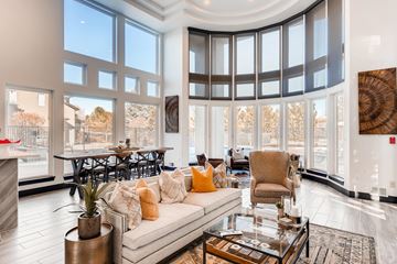 Denver apartment for rent - A living room with a large couch and a fireplace.